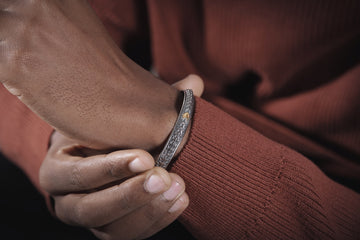 a close up of a person wearing a bracelet